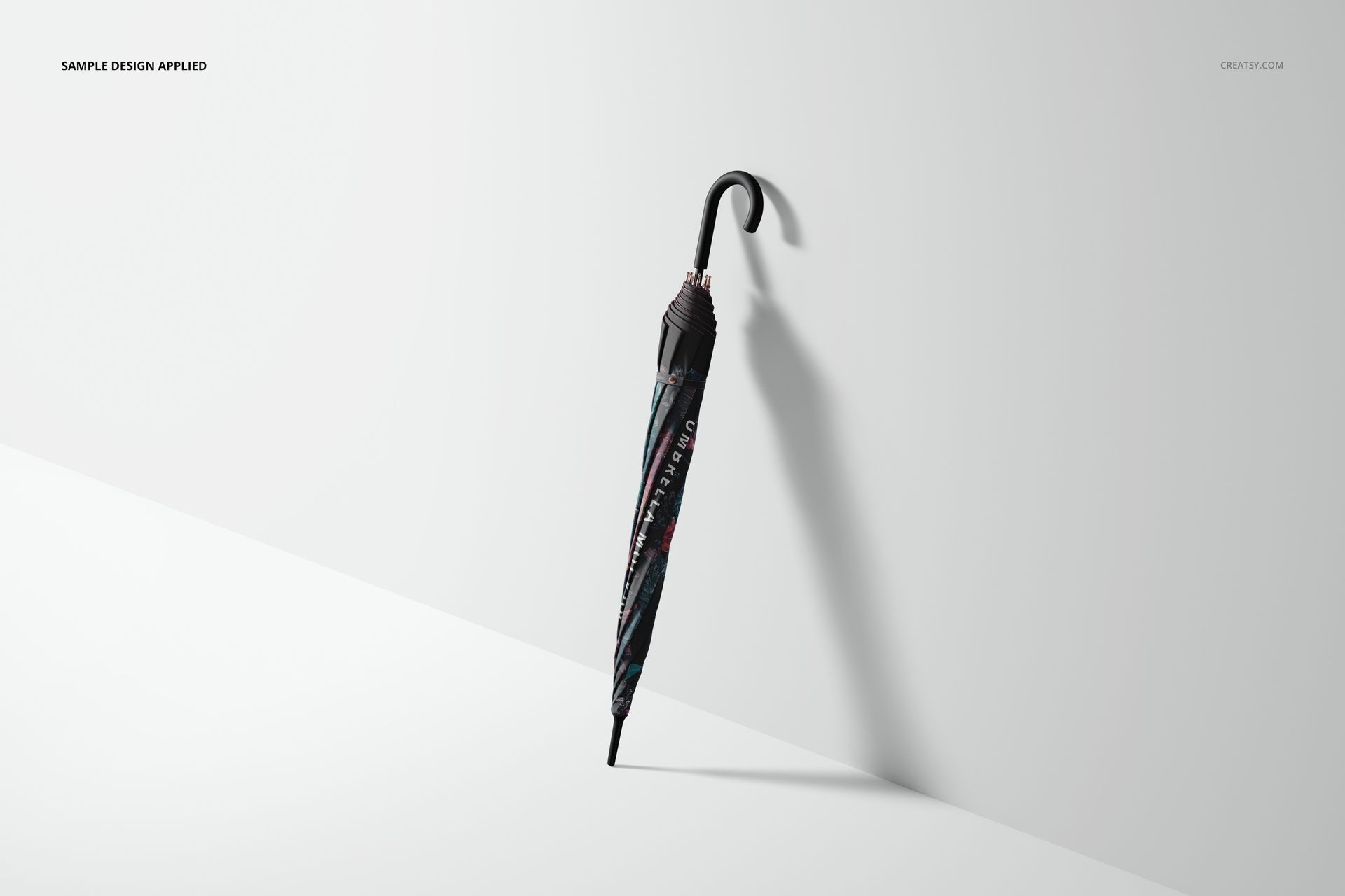 Umbrella mockup set showing a folded umbrella with black and gray pattern, positioned upright on a white surface.
