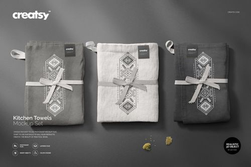 Kitchen towels mockup showing three neatly folded towels with decorative embroidery, presented on a neutral surface.
