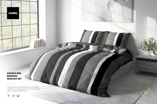 Front view of a double bed mockup with striped duvet and pillows in grayscale tones, set against a white brick wall.