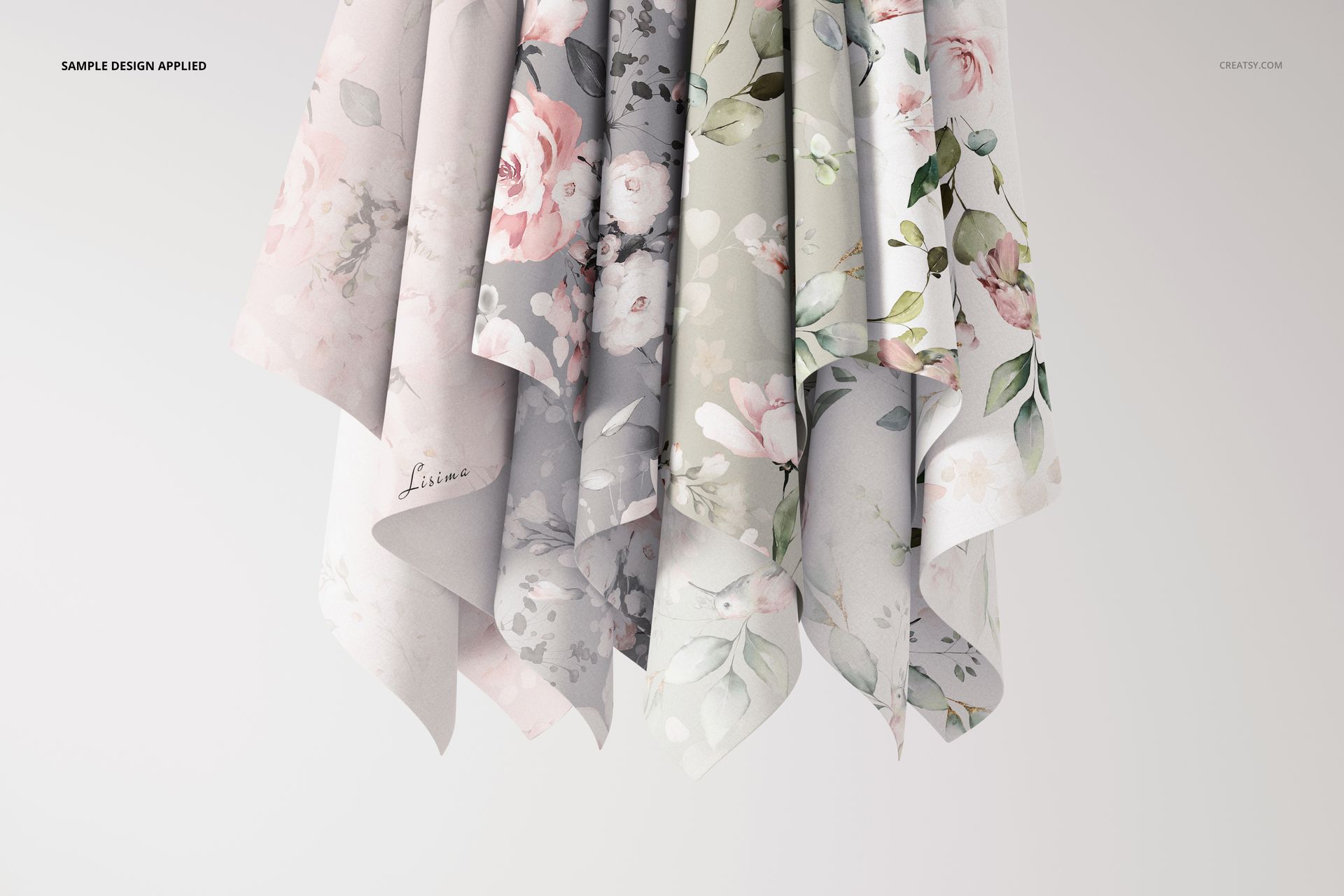 PSD mockup displaying multiple hanging textiles with elegant botanical prints, arranged against a plain backdrop.