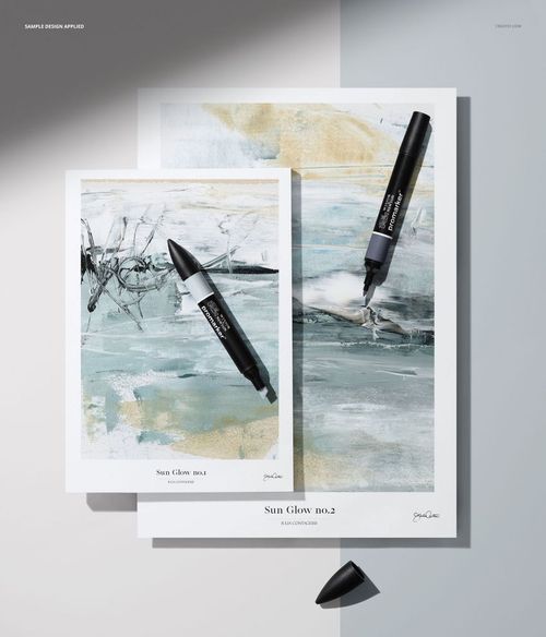 PSD mockup displaying colored pencils and paper pads with artistic prints, viewed from a top perspective on a neutral background.