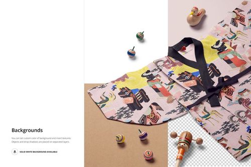 Front view of a patterned kids yukata mockup laid out on a table, accompanied by traditional wooden toys and neutral backgrounds.