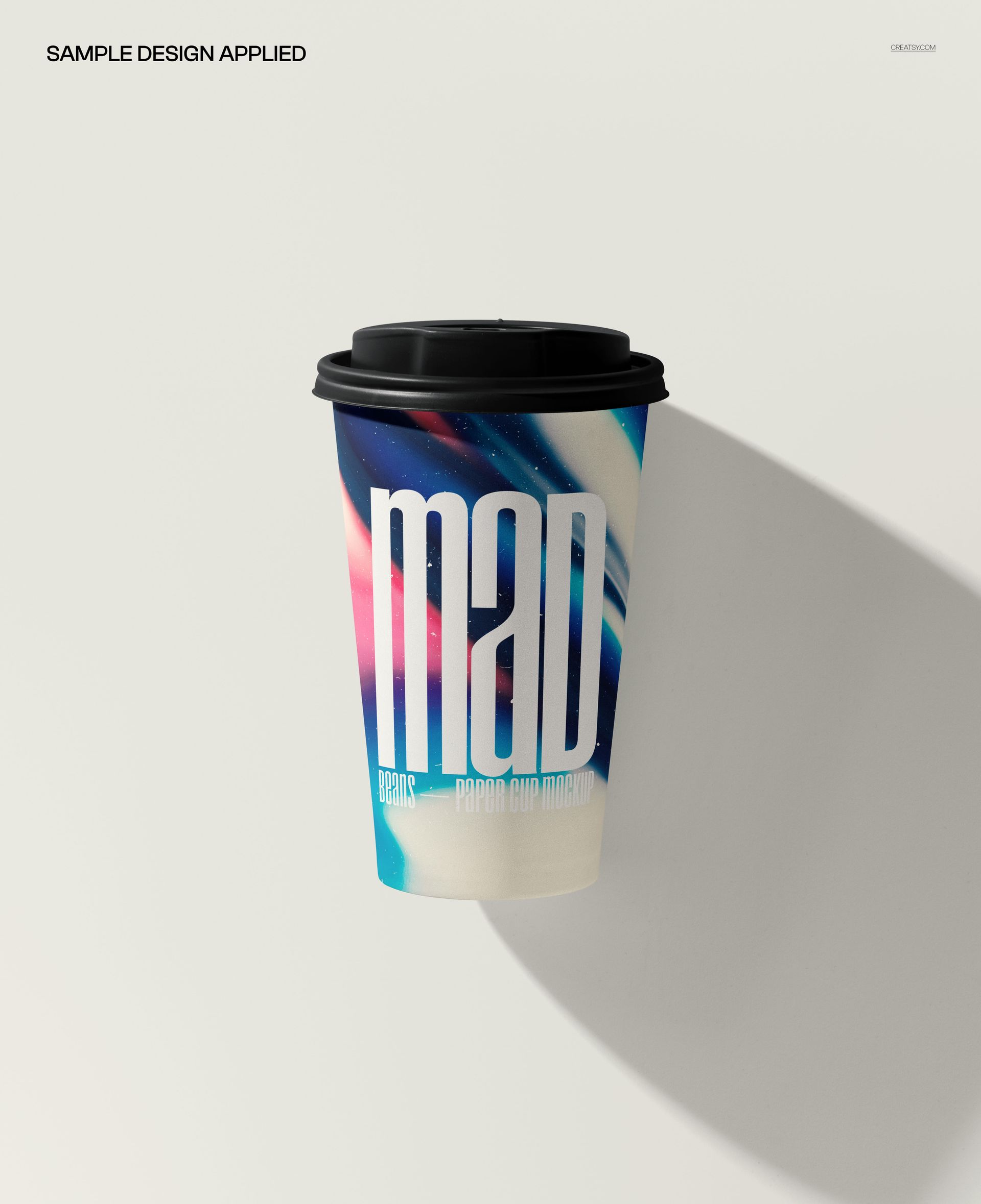 Paper coffee cup mockup shown from above, with a black lid and swirling blue, pink, and white pattern.