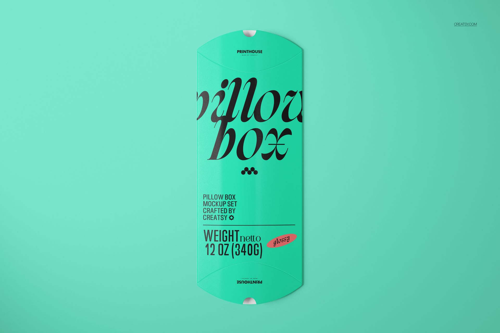 Turquoise pillow box mockup displayed flat, featuring large black lettering and simple graphic elements.