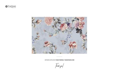 Jersey fabric mockup featuring a pile of material with scissors and buttons, decorated with a floral pattern on a light blue background.
