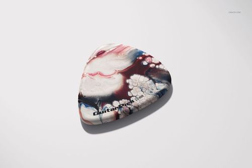 Single guitar pick mockup with swirling marbled design in pink, navy, and cream, displayed from a top angled view.