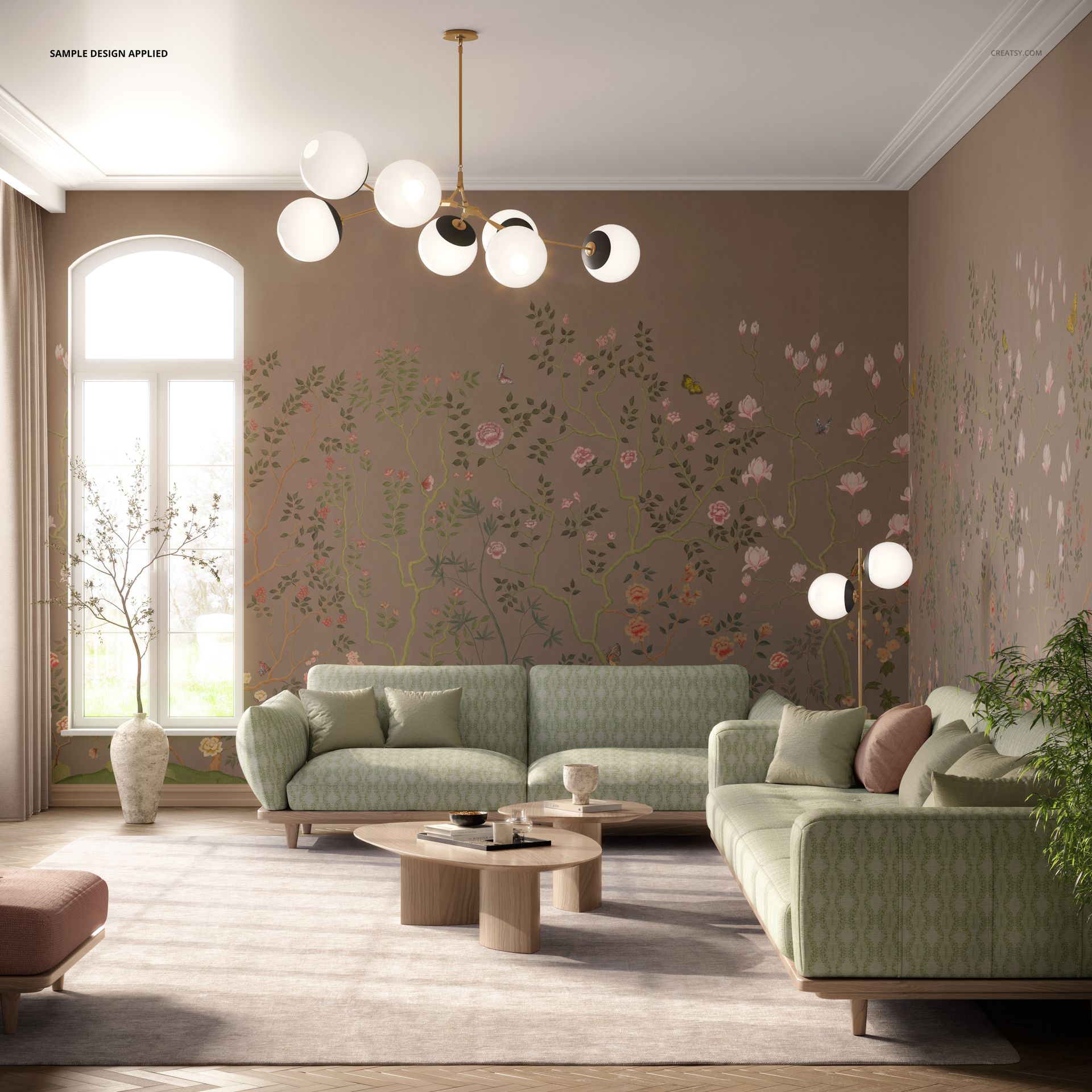 Modern living room mockup featuring two green patterned sofas, a round wooden coffee table, and floral wall art.