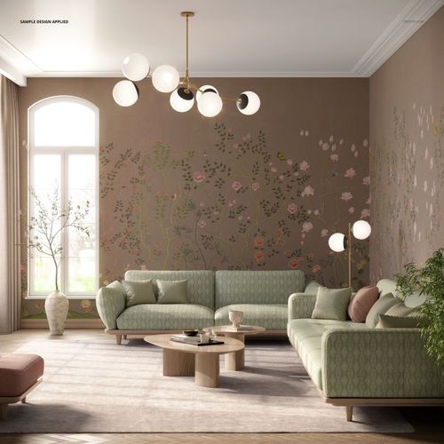 Modern living room mockup featuring two green patterned sofas, a round wooden coffee table, and floral wall art.