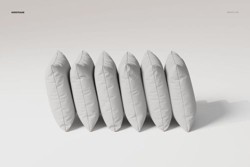 Six velvet cushions arranged in a row, viewed from the side, featuring a soft gray color on a plain background.