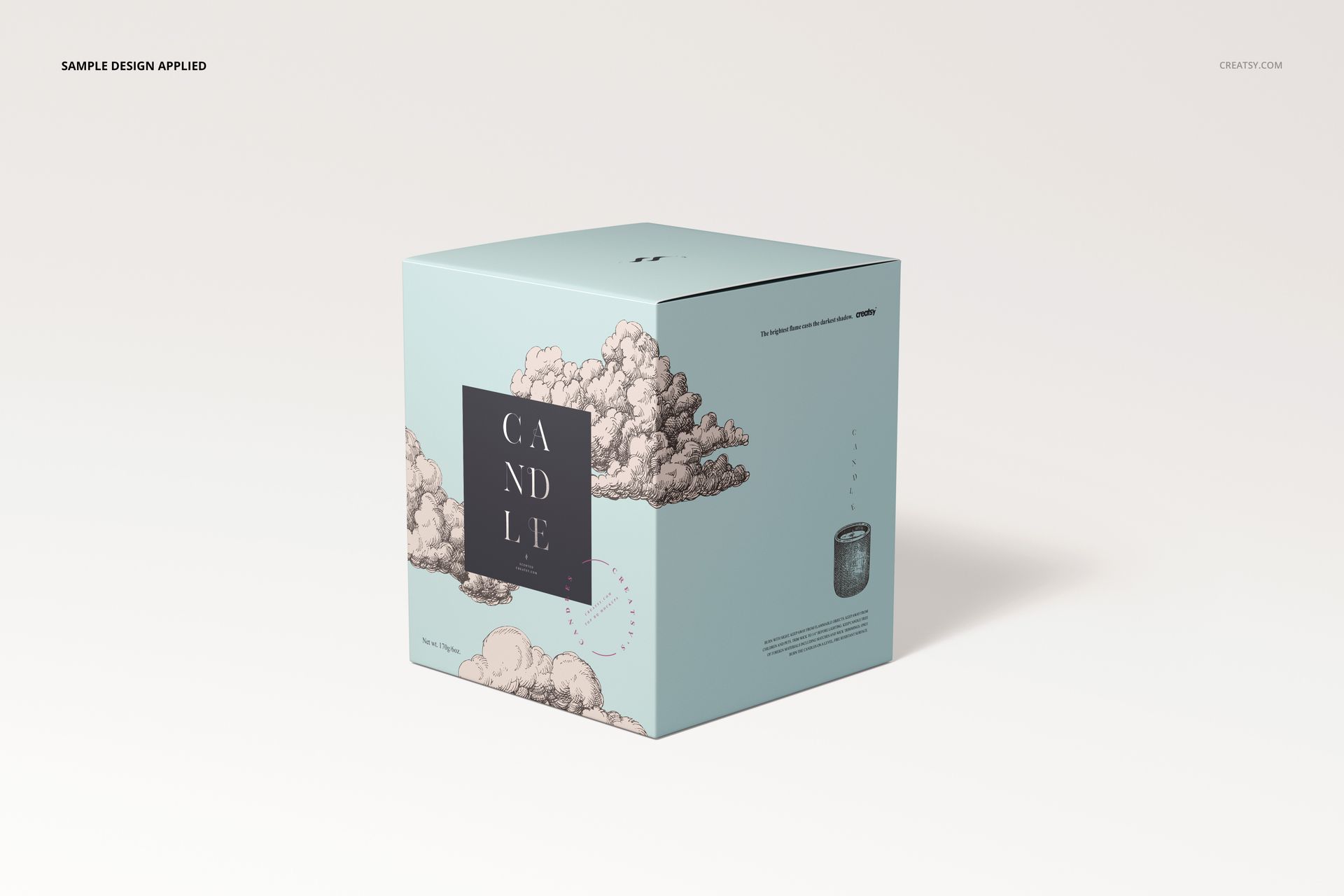 Front view of a square cotton wick candle box mockup in light blue with cloud illustrations and a dark label.