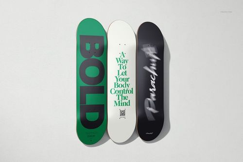 Vertical arrangement of three skateboard decks with distinct typography, shown on a plain background in a PSD mockup.