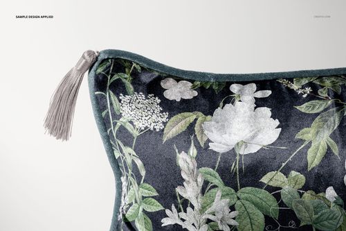 Rectangular velvet pillow mockup with tassels, displaying a botanical design in shades of green and white.