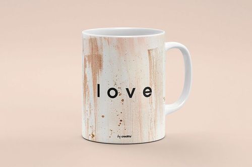 Front view of a white mug mockup with abstract brown paint streaks and bold black text on a neutral beige background.