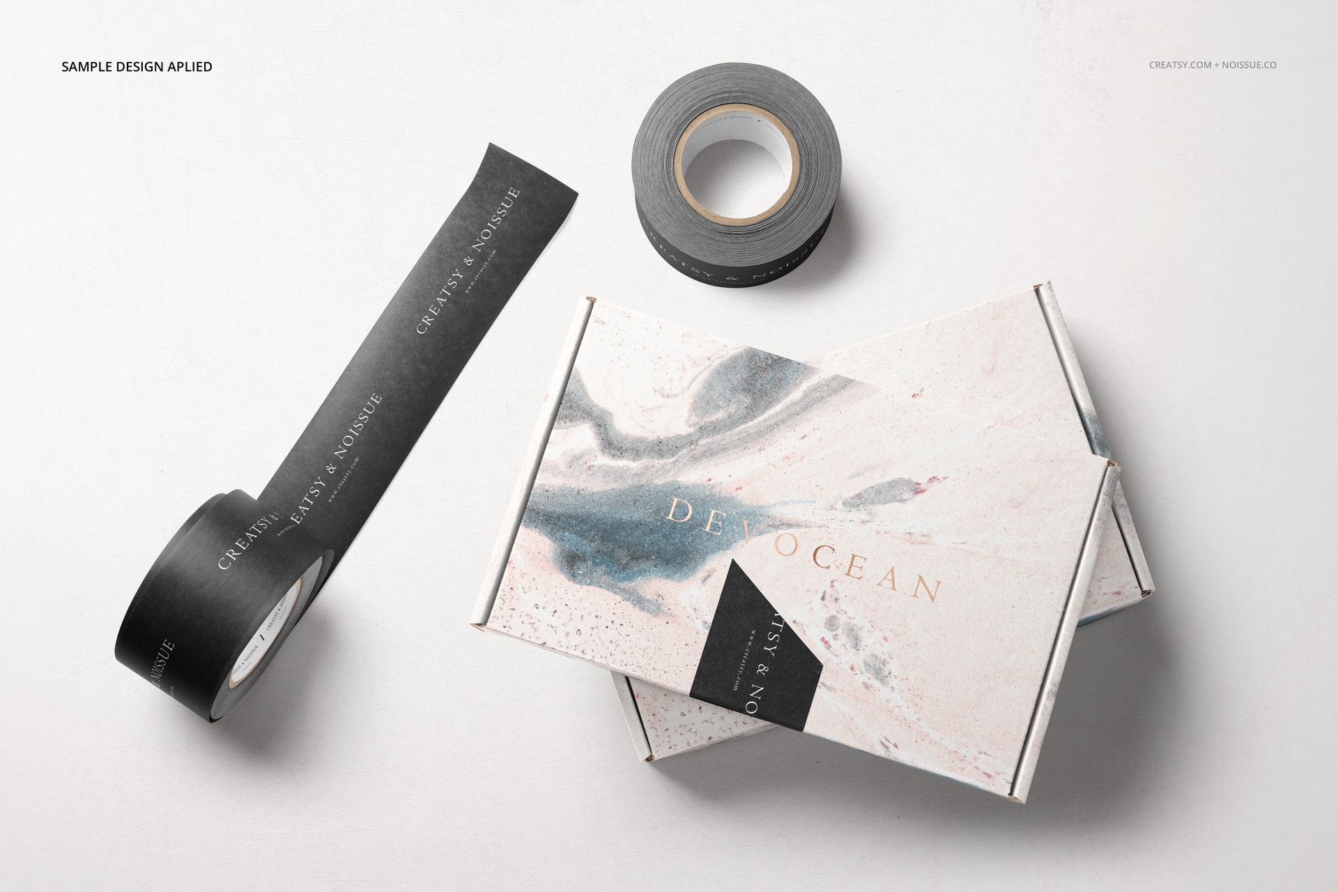 PSD mockup set featuring mailing boxes with soft marble textures and black tape, arranged on a pale background.