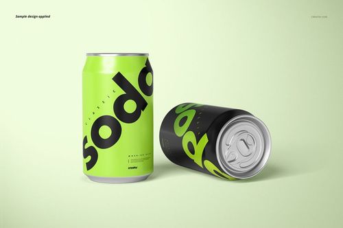 Two drink cans with bold text design, one upright and one lying down, on a light green background in a mockup scene.