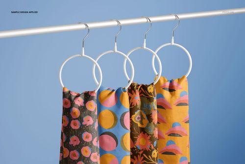 Fashion accessories mockup showing four patterned silk scarves on white hangers, viewed from the front with a blue background.