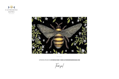 Front view of a silk cushion mockup with a braided edge, decorated with a bee, foliage, and floral pattern.