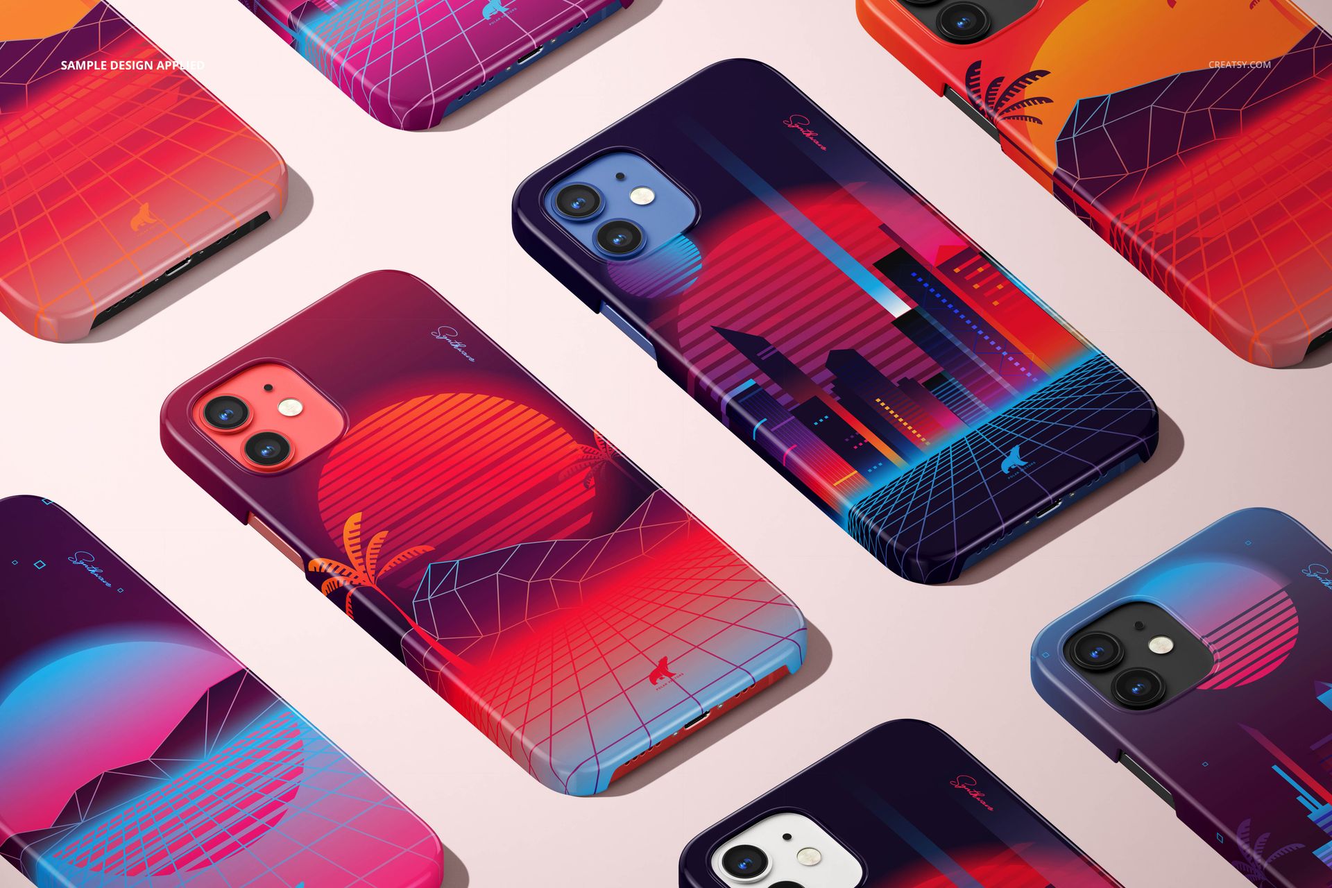 Top view of iPhone 12 mockup cases in various colors, decorated with neon-inspired sunset and city graphics on a pale background.