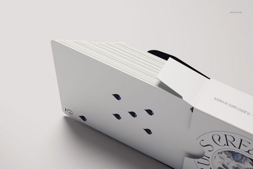 PSD mockup of playing cards in a white package, side view with visible card faces and clean background.