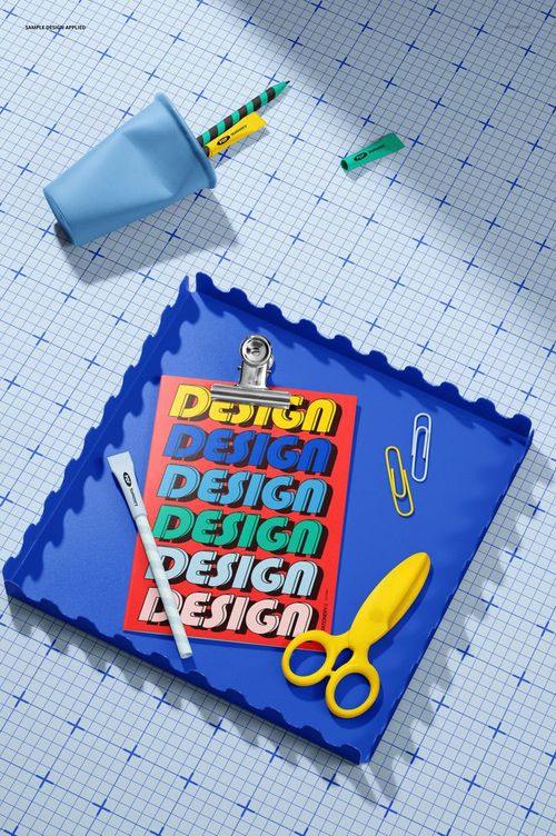 Back to school greeting card mockup displayed on a blue tray with scissors, pen, and paper clips on a graph paper background.