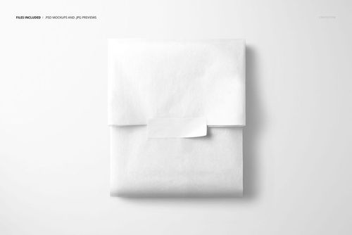 PSD mockup featuring white tissue paper wrap closed with a rectangular sticker, set against a minimal background.