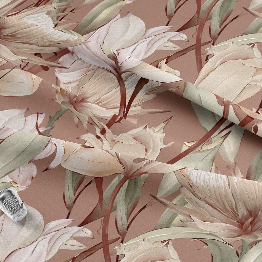 Lying fabric mockup featuring a seamless dry flowers pattern in soft beige and pink tones, shown from above on a flat surface.