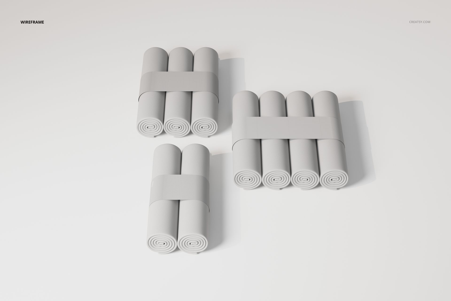 Three sets of rolled changing pad papers grouped in bundles, shown from a top view on a plain white background.