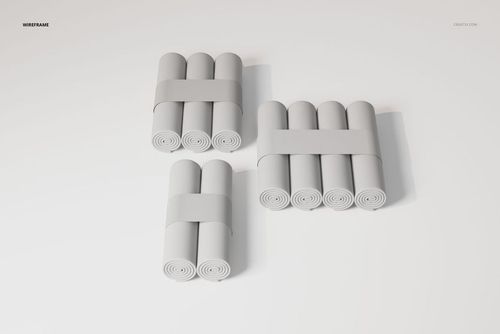 Three sets of rolled changing pad papers grouped in bundles, shown from a top view on a plain white background.