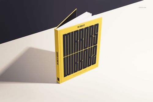 Yellow hardcover book mockup positioned at an angle, featuring large black lettering and partially open pages.