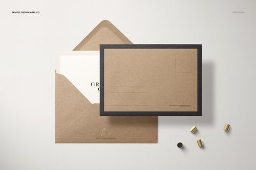 Mockup of a brown kraft paper envelope with a card partially inserted, shown from above with minimal accessories.