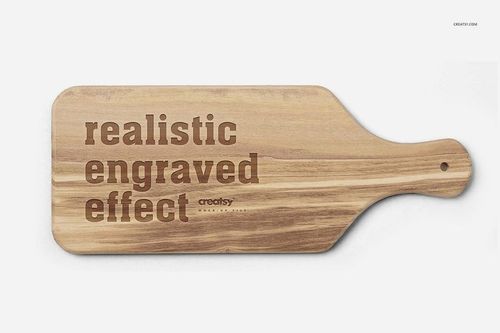 Engraved wooden board mockup shown from above, highlighting natural wood grain and realistic engraved lettering.