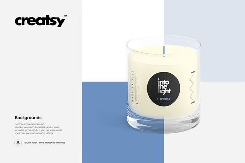 Scented candle mockup in a transparent glass jar with white wax, black label, and blue wick, displayed front-facing.