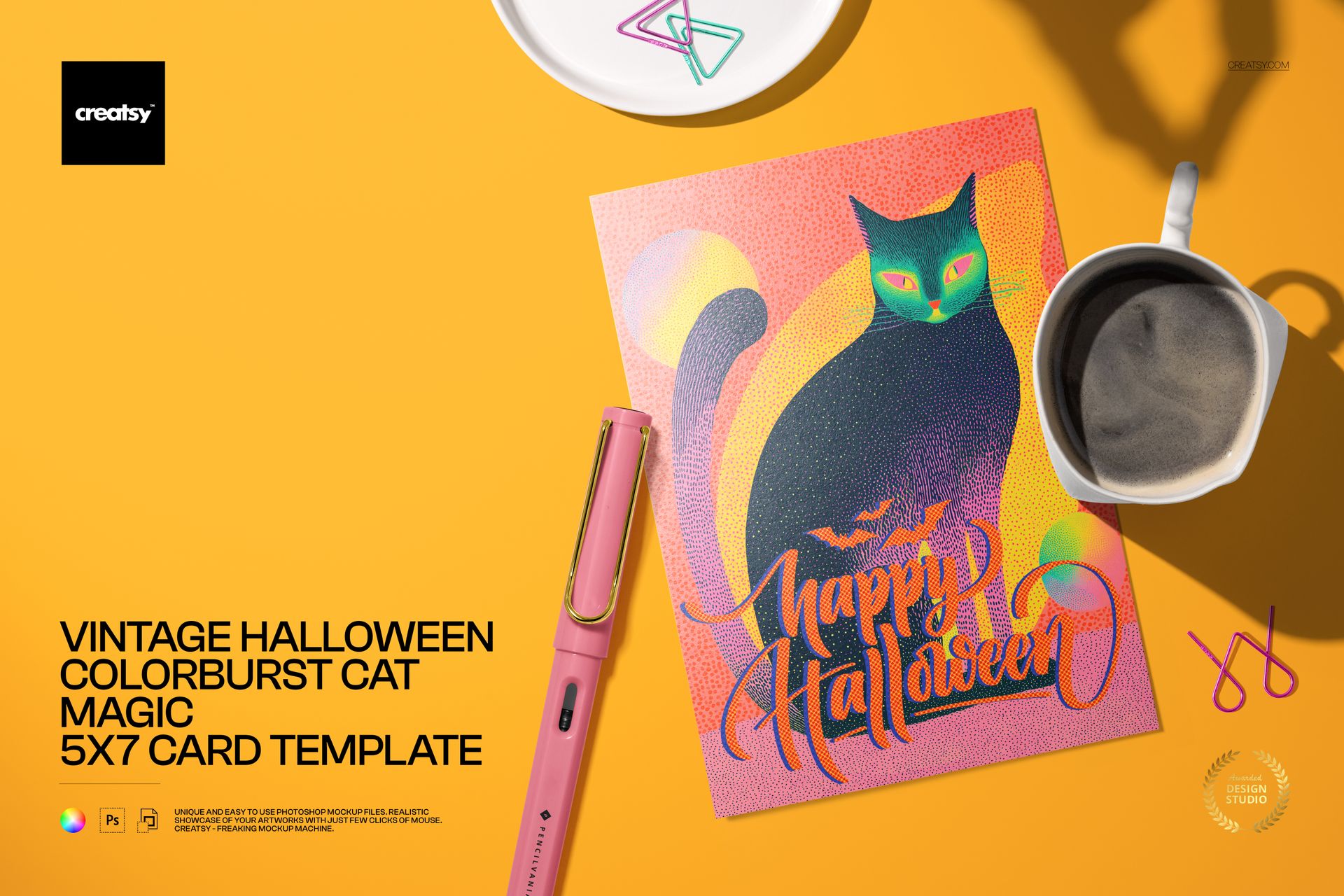 Halloween card PSD mockup with a vibrant cat design, orange background, and festive lettering, shown with props.