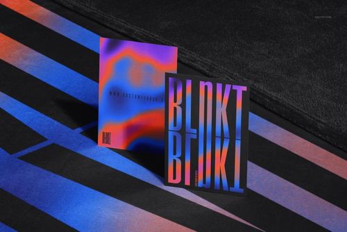 Fleece blanket mockup with a dark textured surface, shown alongside two colorful abstract posters on striped background.