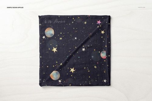 Square muslin swaddle blanket mockup with dark background, colorful stars and planets, top view on light surface.