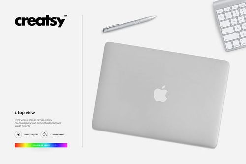 MacBook skin case mockup in PSD format, showing a closed laptop from above with pen and keyboard nearby.