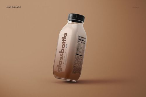 Angled glass bottle mockup with a black lid, beige liquid inside, and prominent label on a solid brown backdrop.