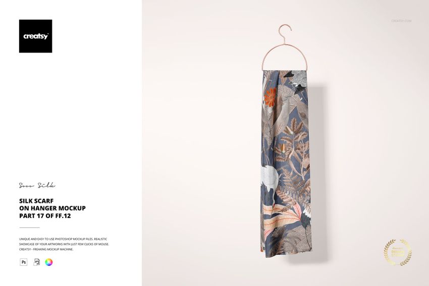 Front view of a silk scarf featuring a mix of floral and geometric designs, displayed on a simple hanger in a mockup scene.