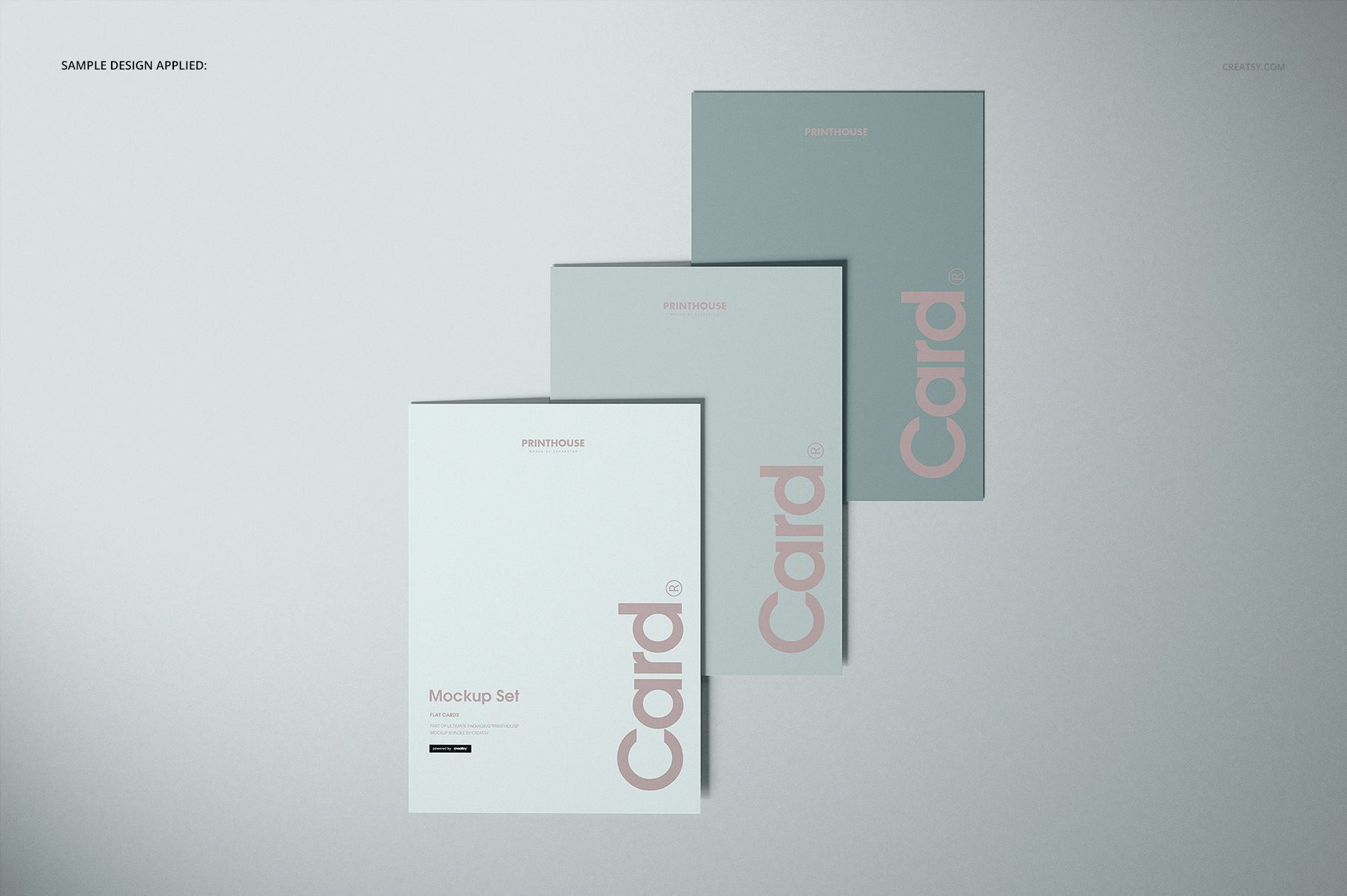 Flat cards mockup set showing trio of rectangular cards with modern typography, viewed from above on a light surface.