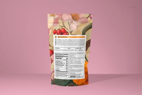 Back view of a paper pouch mockup featuring colorful flower and berry artwork, set against a solid pink backdrop.