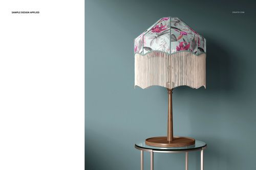 Tassel shade table lamp mockup featuring a wooden base and a patterned shade with long white tassels, set in a modern room.