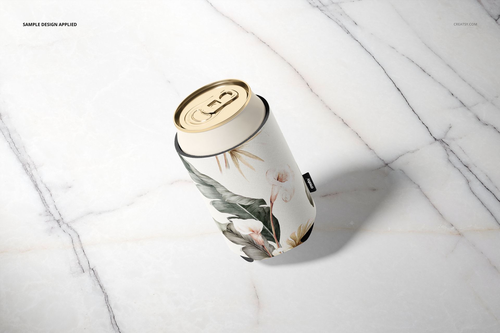 Floral neoprene can cooler mockup featuring a beverage can on a light marble background, viewed from above.