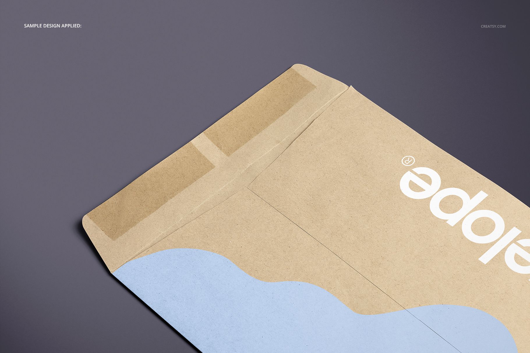 Close-up of a brown paper envelope mockup with blue wave design and white lettering on a neutral background.