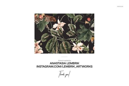 PSD mockup displaying a velvet sofa surface with a lush floral and leafy print, viewed from a front-facing angle.