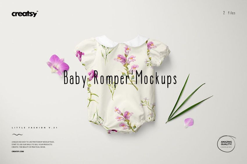Baby romper mockup displayed flat, decorated with pink flowers and green leaves, shown from above on a light surface.