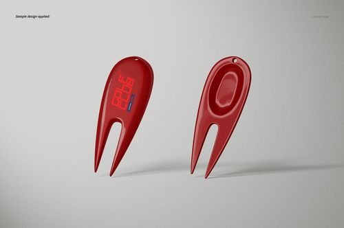 Two red golf divot tools displayed on a light gray background, shown from front and back angles with smooth surfaces.