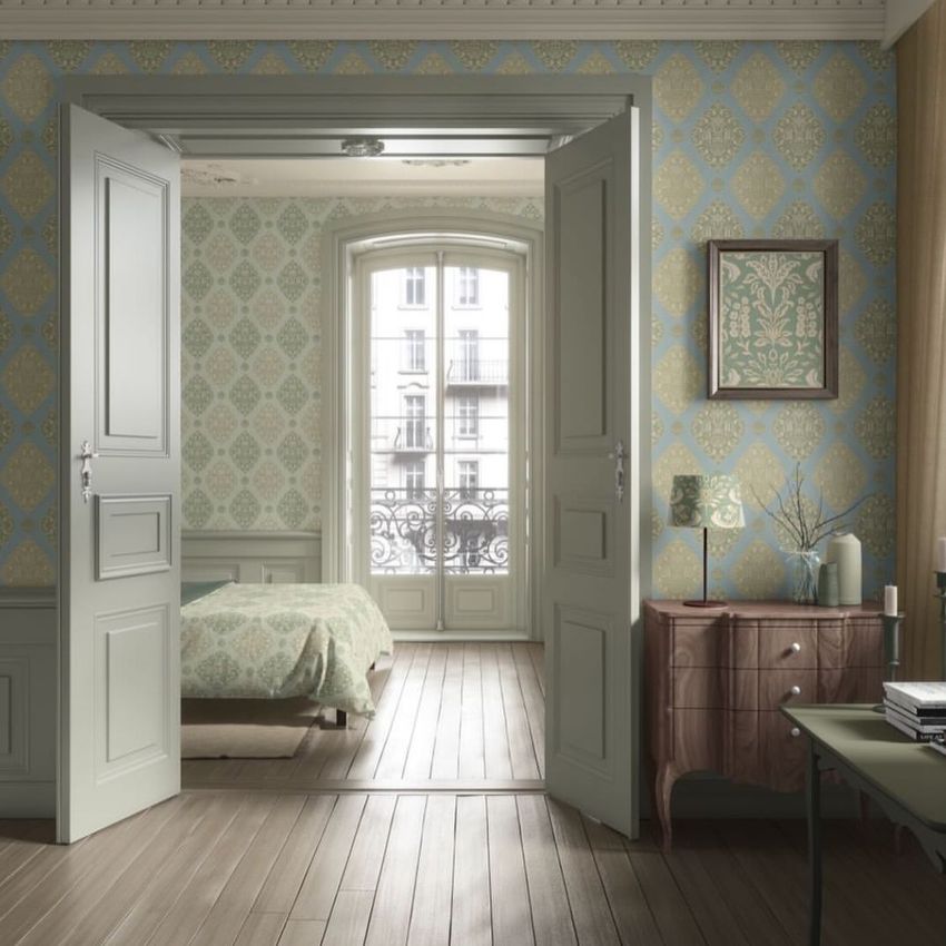Classical apartment wallpaper mockup showing an elegant room with patterned wallpaper, double doors, and vintage furniture.