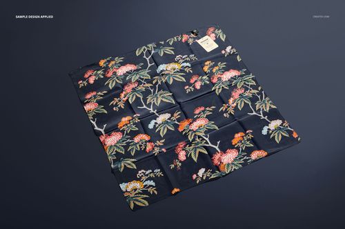 Floral silk scarf mockup featuring botanical designs in multiple colors, shown laid out on a solid dark surface.