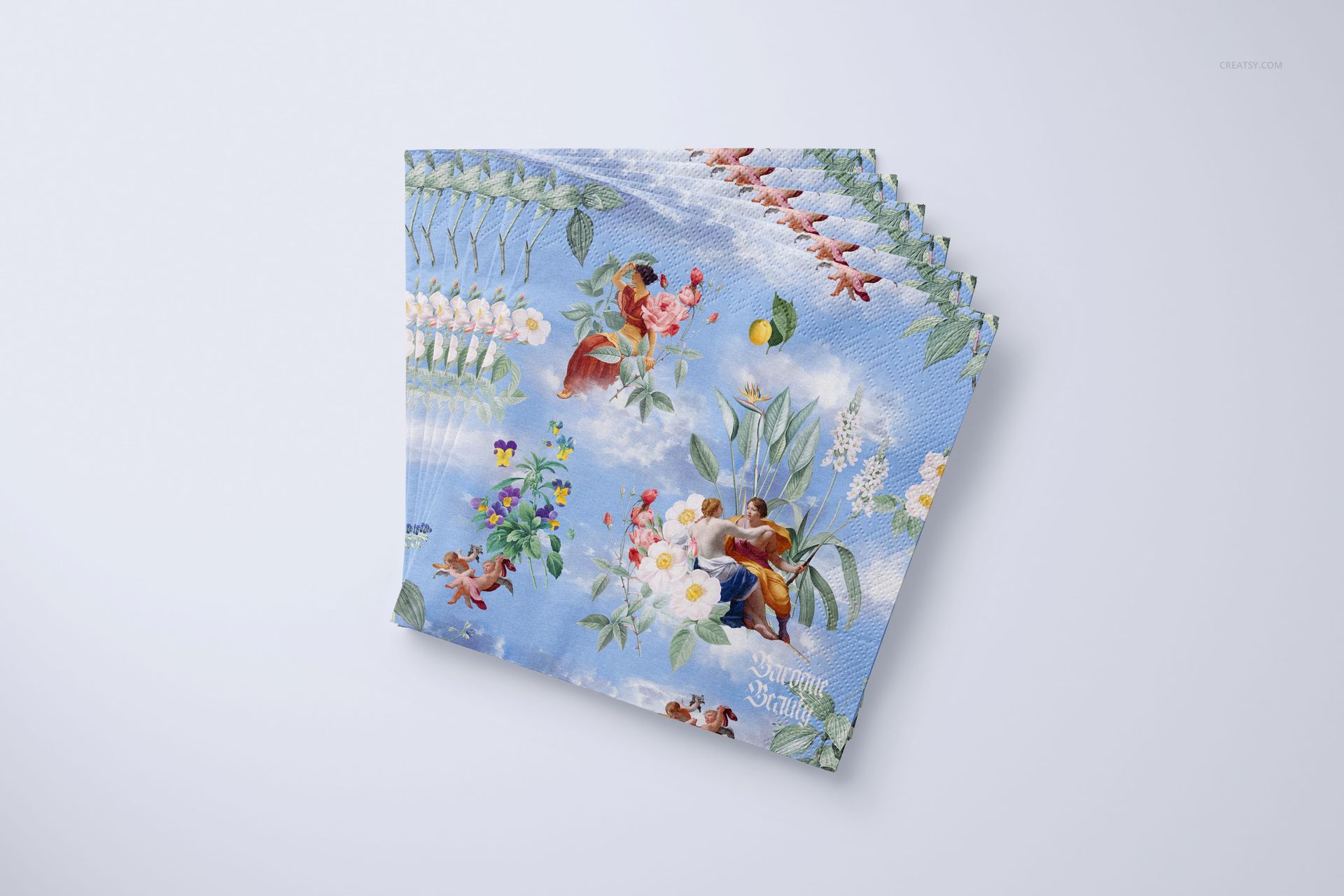 PSD mockup of napkins with colorful flowers and leaves on a blue background, displayed on a clean white backdrop.