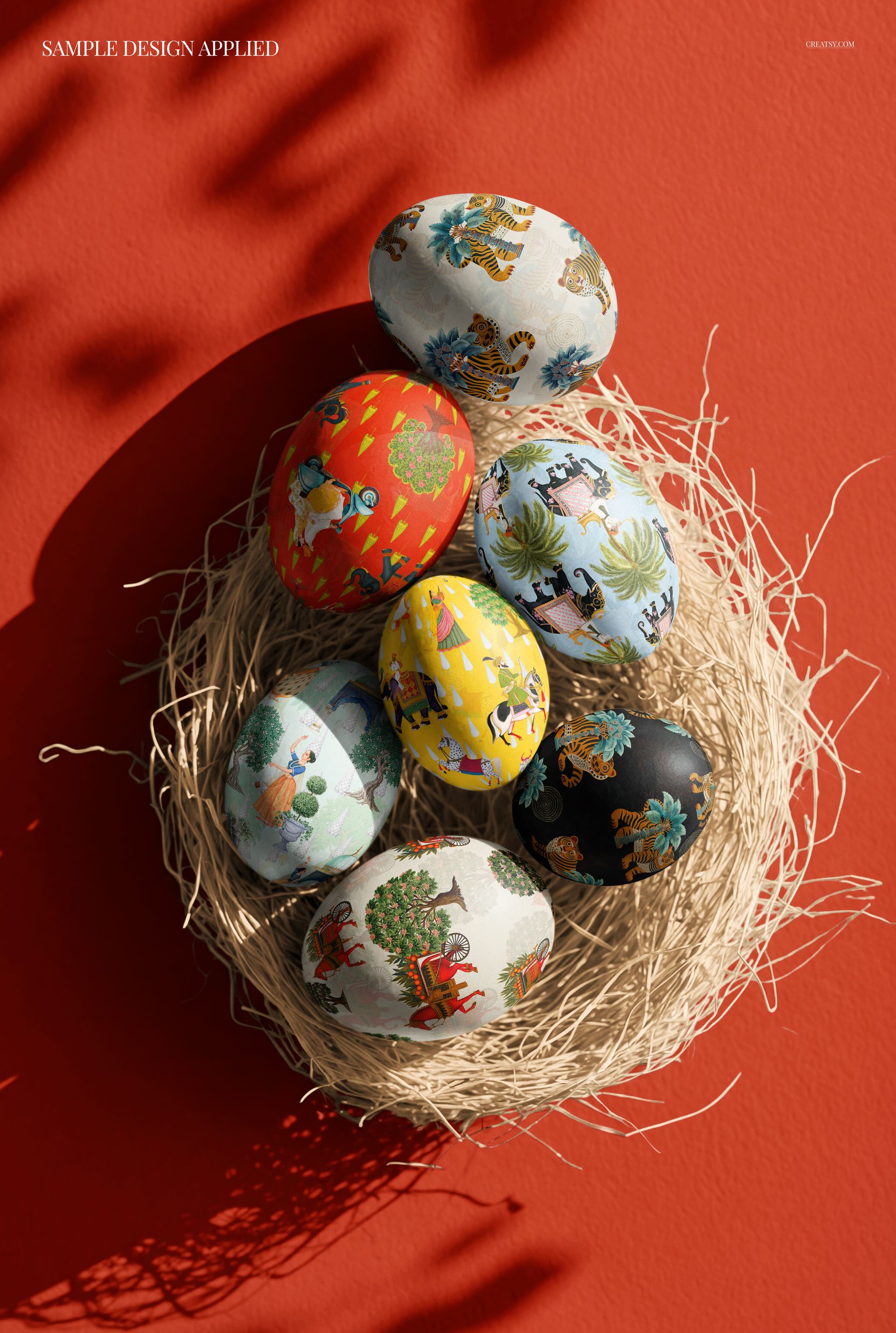 Colorful patterned Easter eggs arranged in a straw nest on a vibrant red background, top view mockup scene.